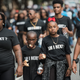 Demonstrators walk down a street outside Bank of America Stadium before an NFL football game between the Charlotte Panthers and the Minnesota Vikings on Sept. 25, 2016, in Charlotte, N.C., in the wake of the fatal police shooting of Keith Lamont Scott.
Sean Rayford/Getty Images
